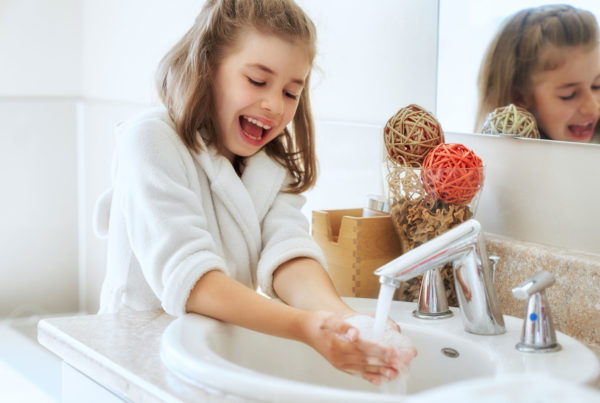 child washing hands